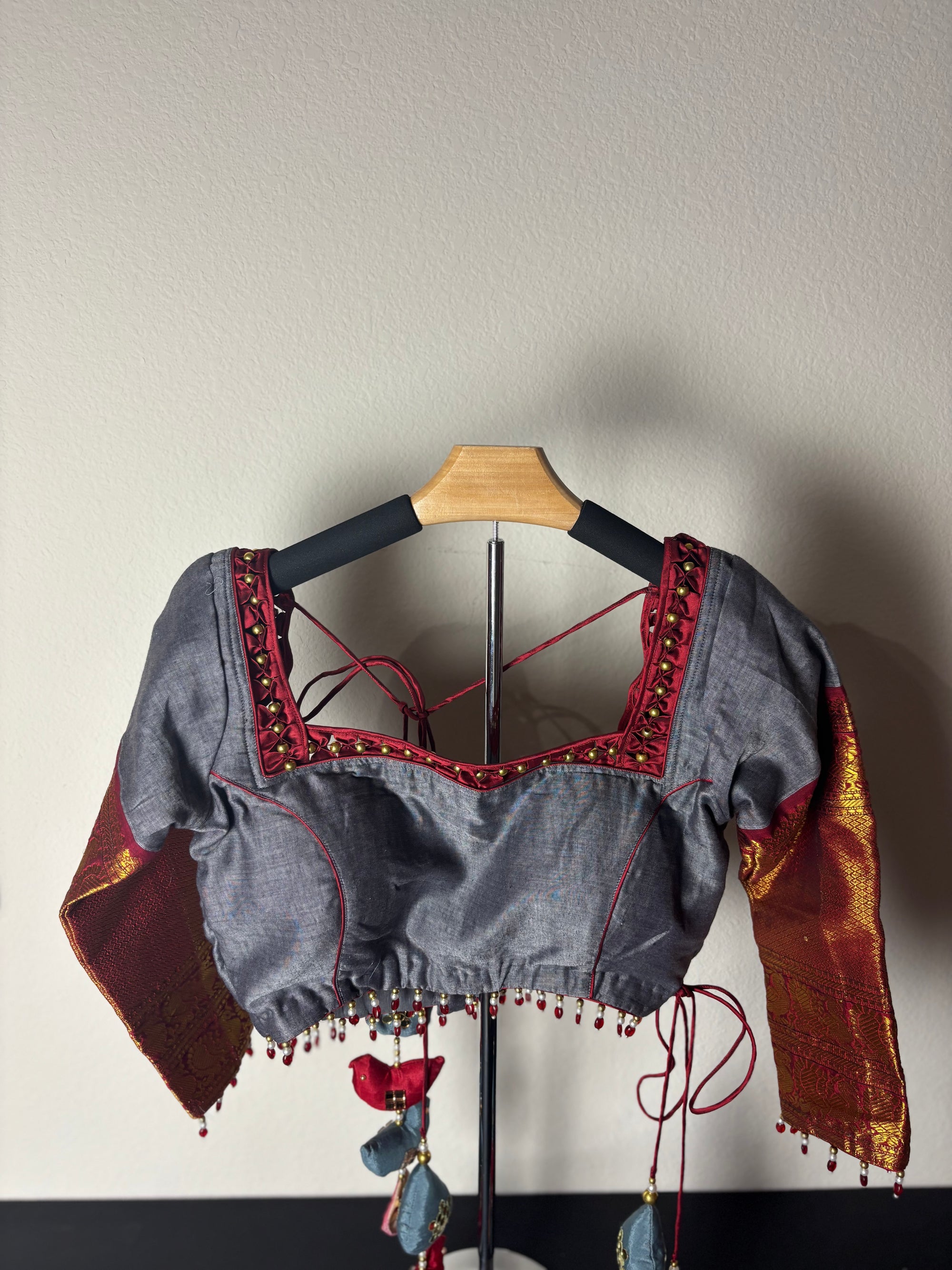 Grey Blouse with Red/Gold Arms and Red Bird tassels with Grey Square Tassels