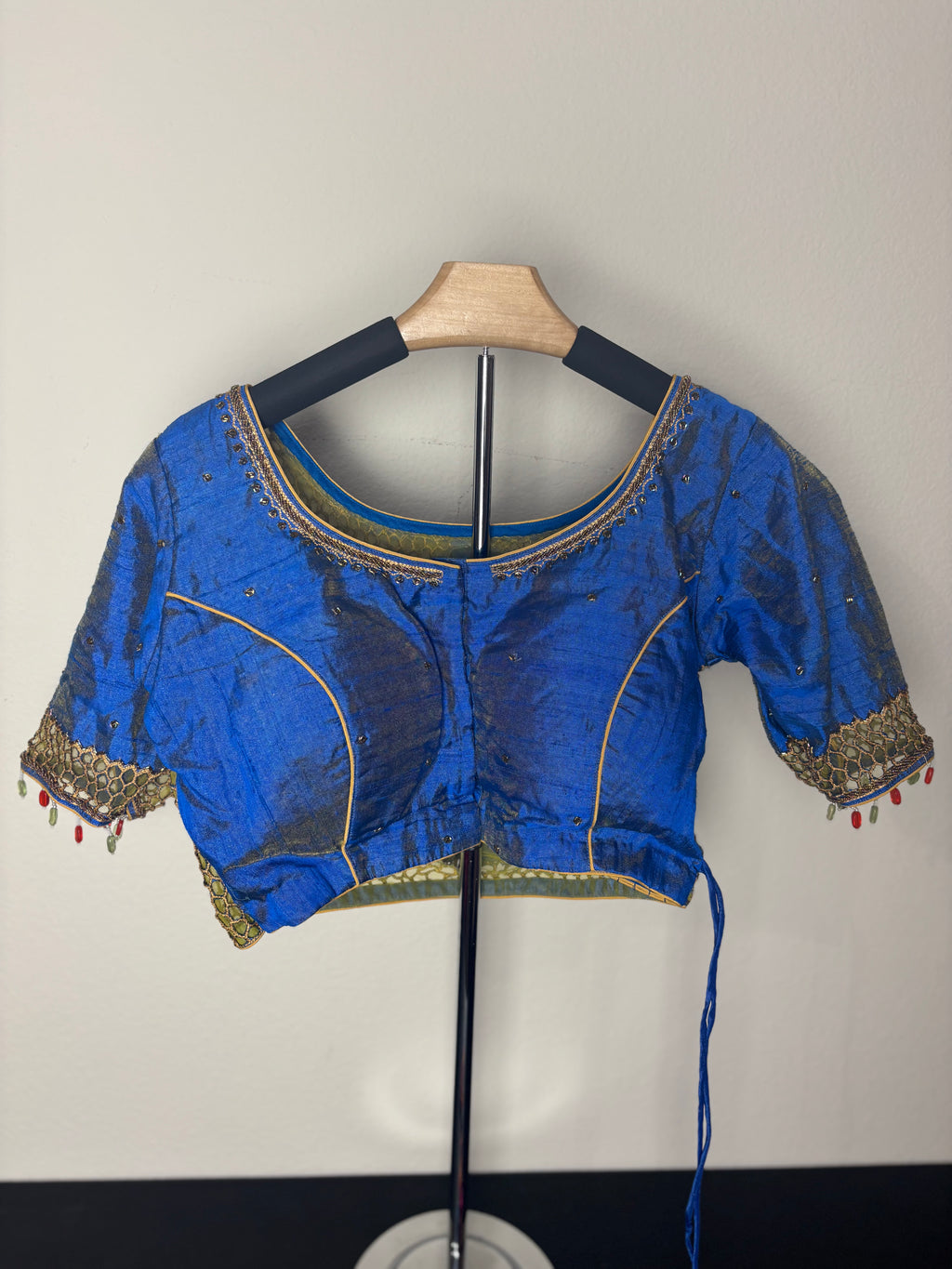 Blue and Gold Painting Blouse with Orange Fishing Tassels with Painting of a Woman on the Back