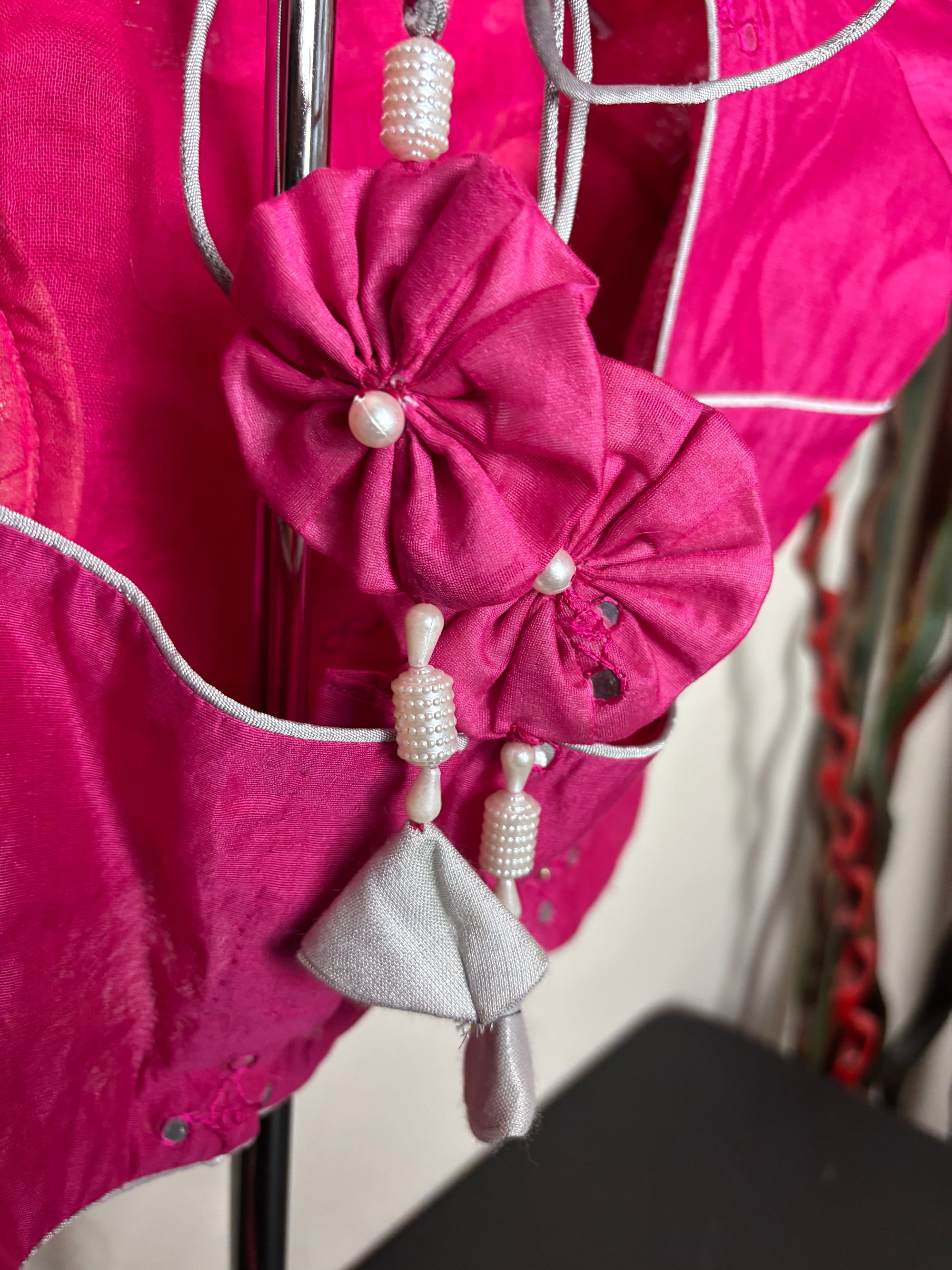 Pink Blouse with Circular Tassels and Silver Additions