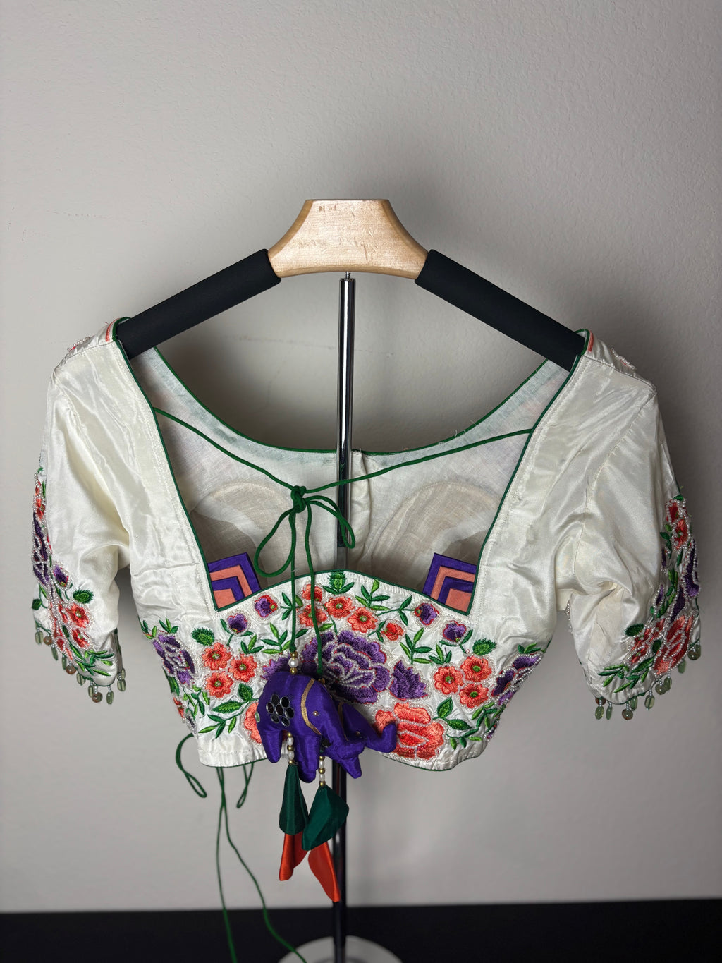 White Blouse with Purple, Orange, & Green Designs on the Hands
