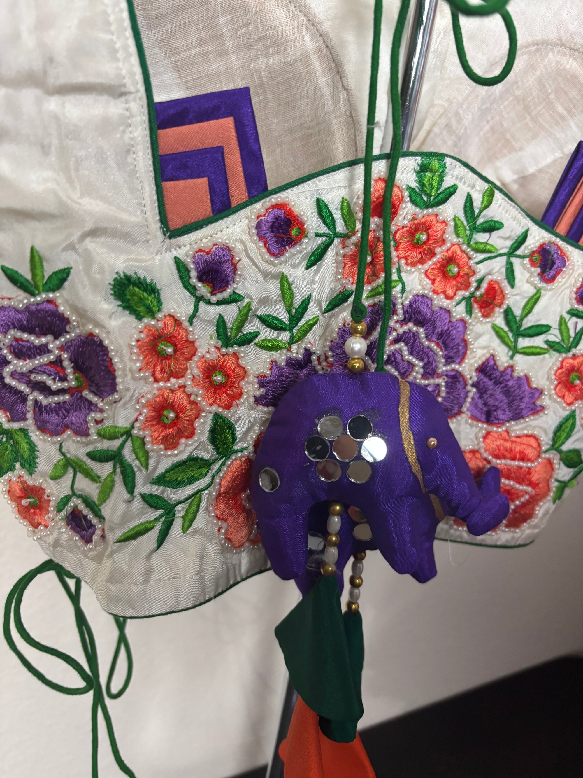White Blouse with Purple, Orange, & Green Designs on the Hands