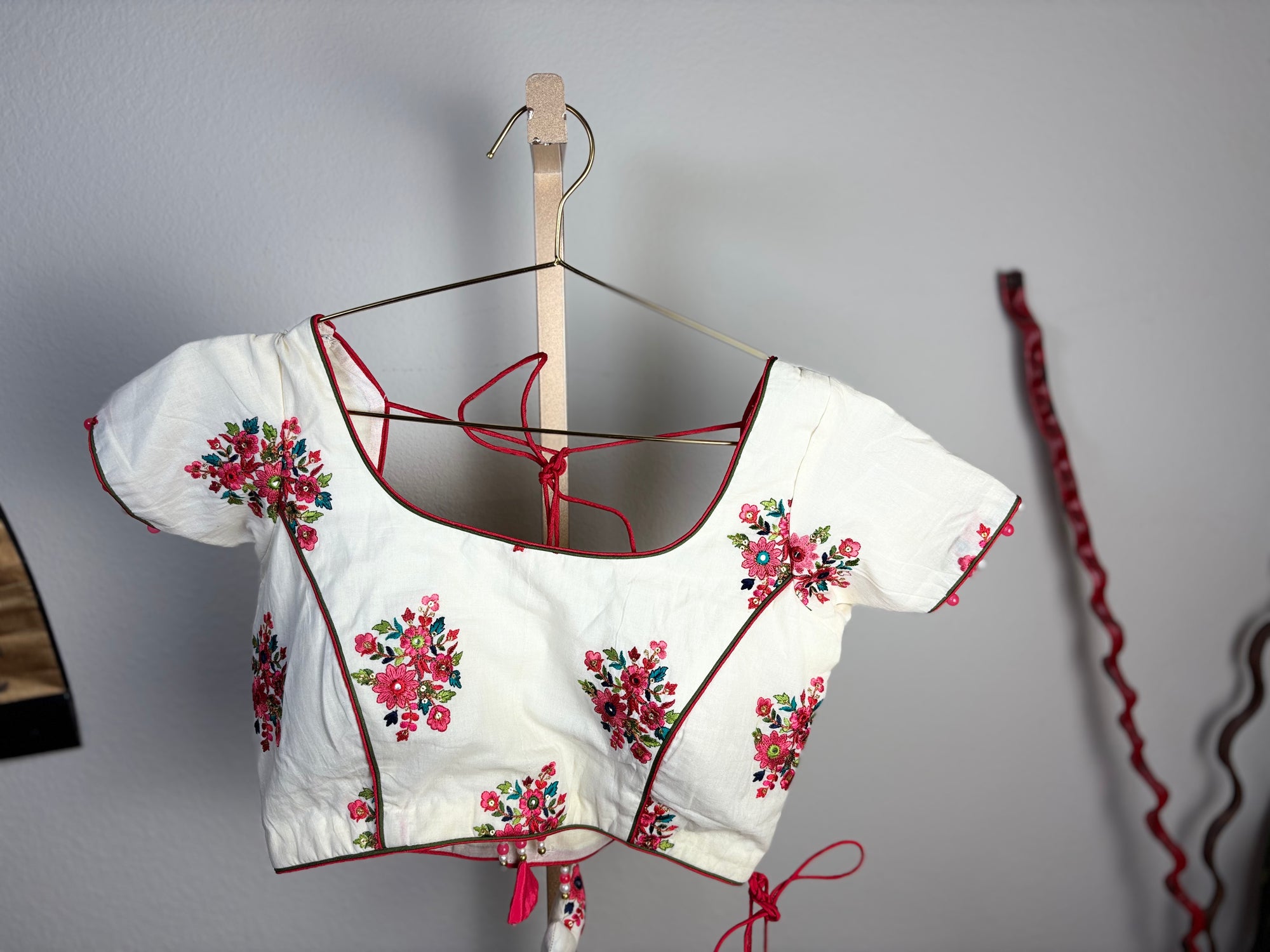White Blouse with Pink and Green Designs and Arrow Like Tassels