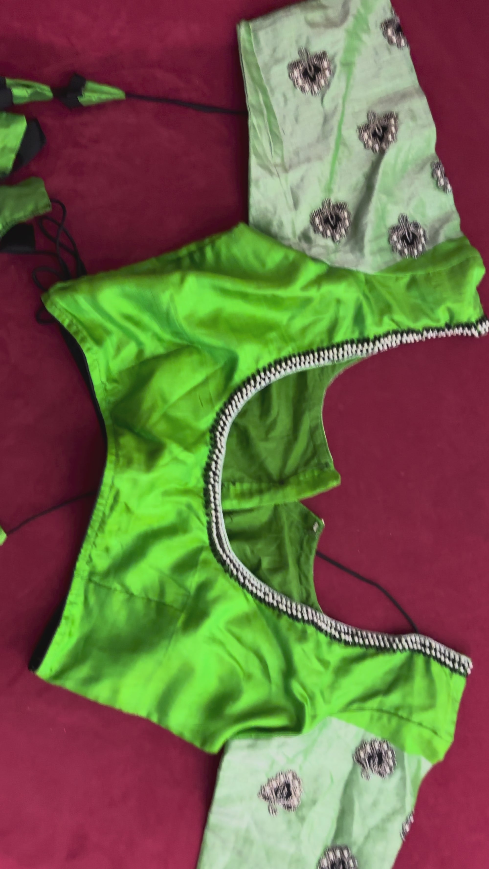 Green Blouse with Purple Flowers on the Hands