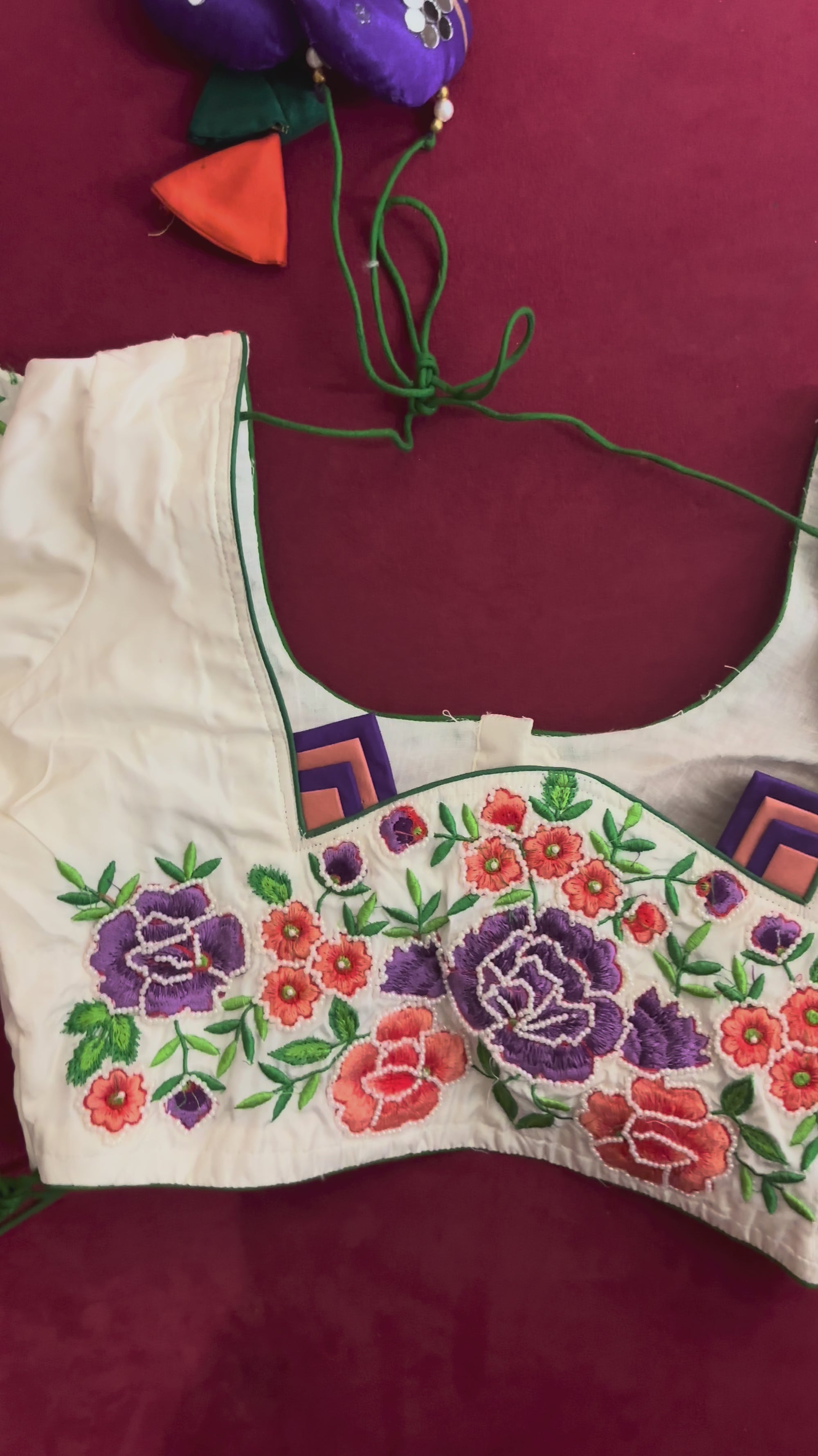 White Blouse with Purple, Orange, & Green Designs on the Hands