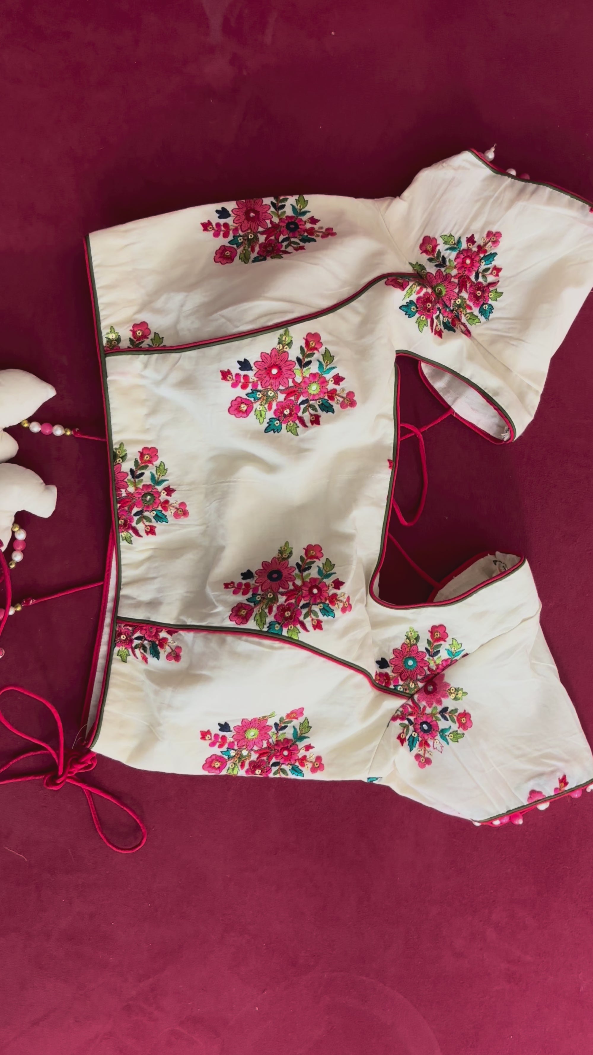 White Blouse with Pink and Green Designs and Arrow Like Tassels